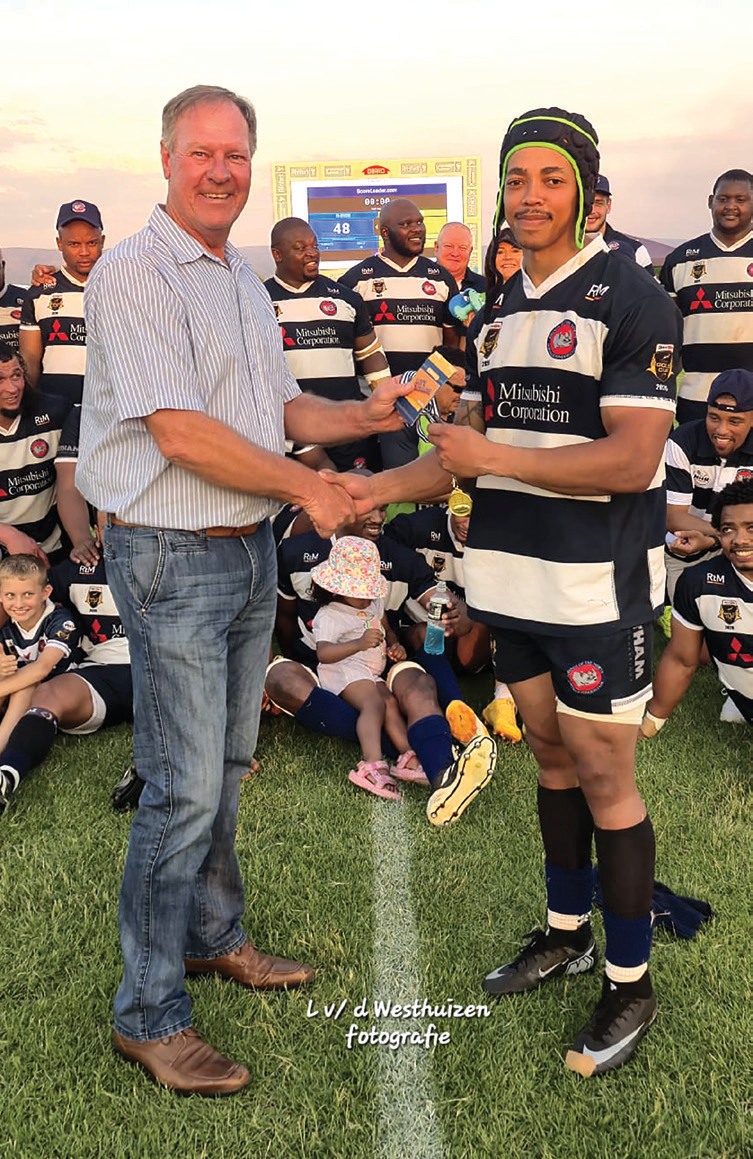 Attie Buitendag, Limpopo rugby manager (left), with Northam Platinum Rhinos flyhalf Jaylen James, whose 21-point contribution earned him the player of the match award.