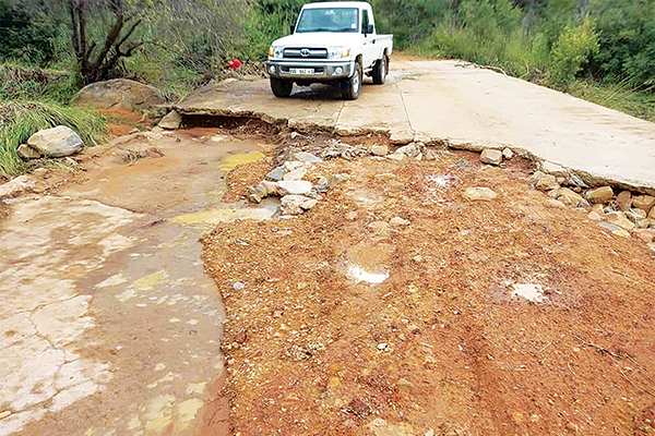 FLASH FLOODS DAMAGE ROADS AND BRIDGES